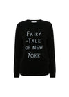Black sweater with 'Fairy Tale of New York' text on a white background