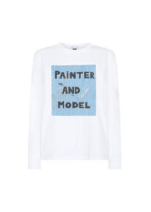 A long sleeve white t-shirt with a text 'Painter and Model' printed on the front.